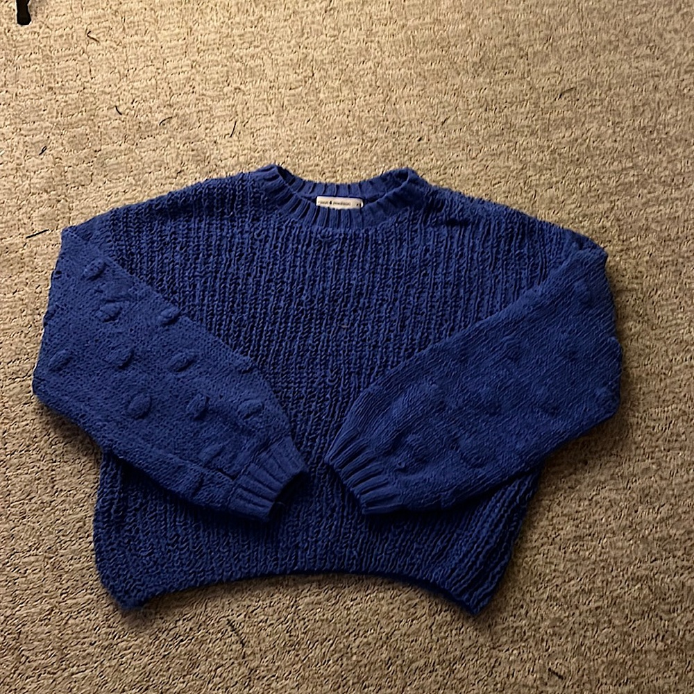 blue crocheted sweater